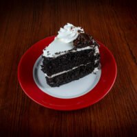 Chocolate Cake, GoGo Pizza, Desserts, rich chocolate dessert, moist chocolate sponge, creamy chocolate frosting, gourmet cake slice, decadent dessert, best chocolate cake near me, layered chocolate cake, sweet treat, chocolate lovers cake