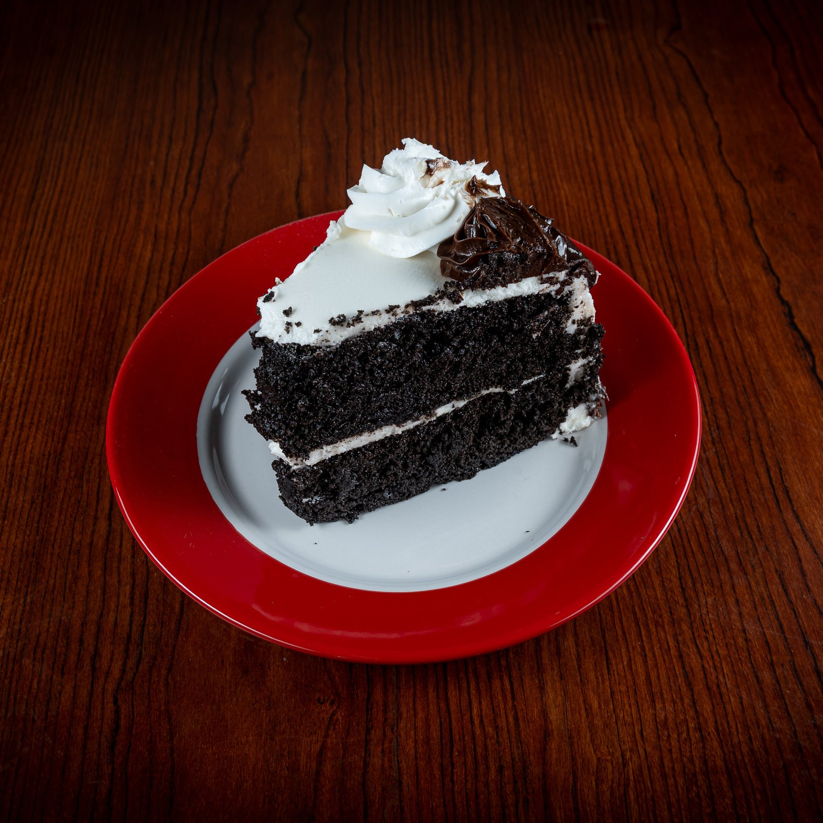 Chocolate Cake, GoGo Pizza, Desserts, rich chocolate dessert, moist chocolate sponge, creamy chocolate frosting, gourmet cake slice, decadent dessert, best chocolate cake near me, layered chocolate cake, sweet treat, chocolate lovers cake